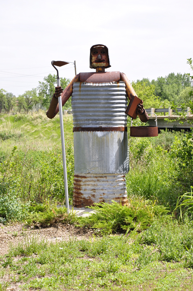 metal sculpture lady gardener